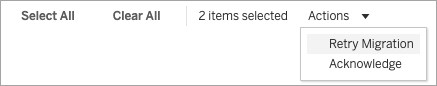 Identity Migration actions dropdown menu with options to Retry Migration or Acknowledge.